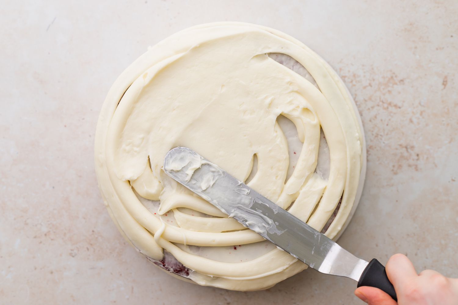 Frost the red velvet cake 