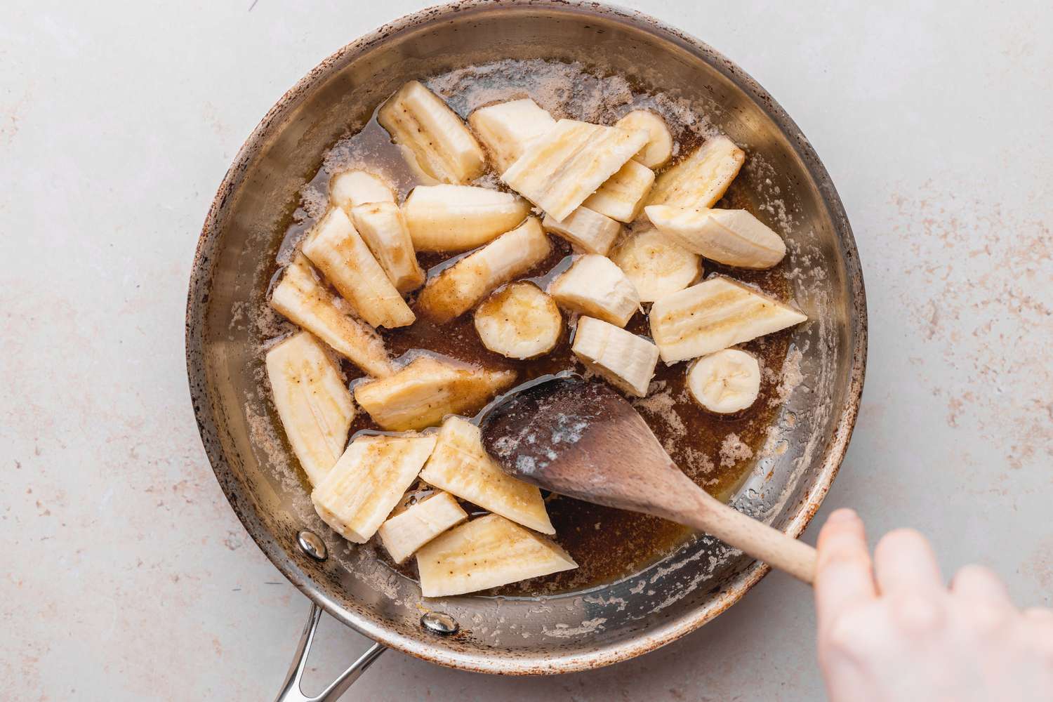 Bananas Coated in Brown Sugar Sauce for Bananas Foster Recipe
