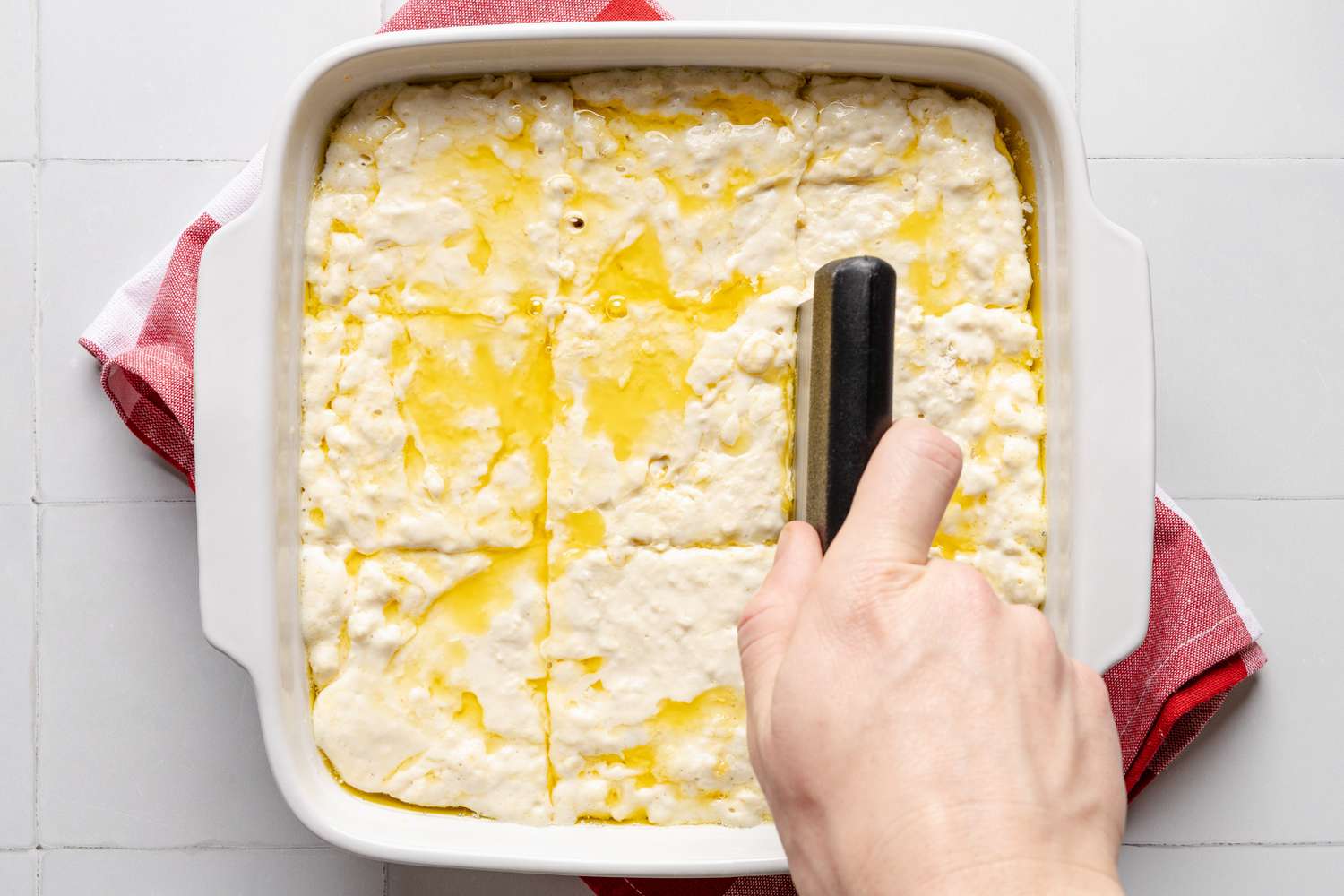 butter swim biscuit dough divided into 9 equal pieces (as a wet dough) using a bench press