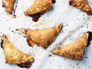 Peach hand pies on parchment paper