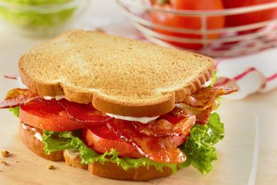 A BLT sandwich with bacon lettuce and tomato on toasted bread