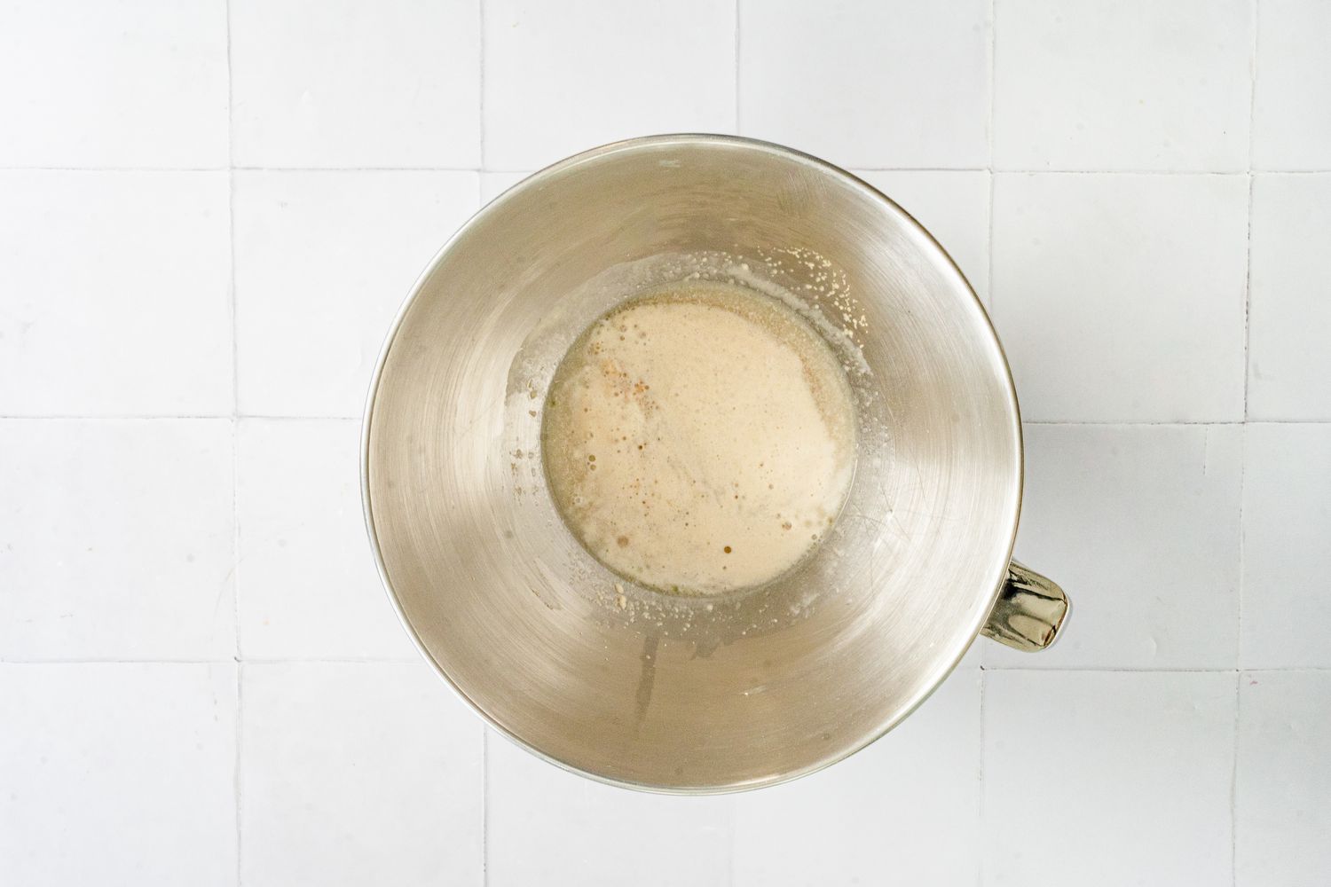 Yeast and Warm Water in a Mixer Bowl for Challah Rolls 