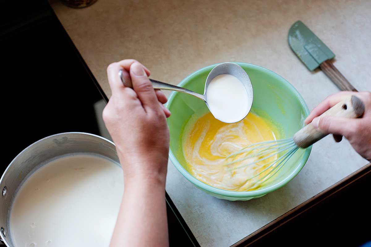 Vanilla Ice Cream with Chocolate and Marshmallows - tempering eggs in a green bowl