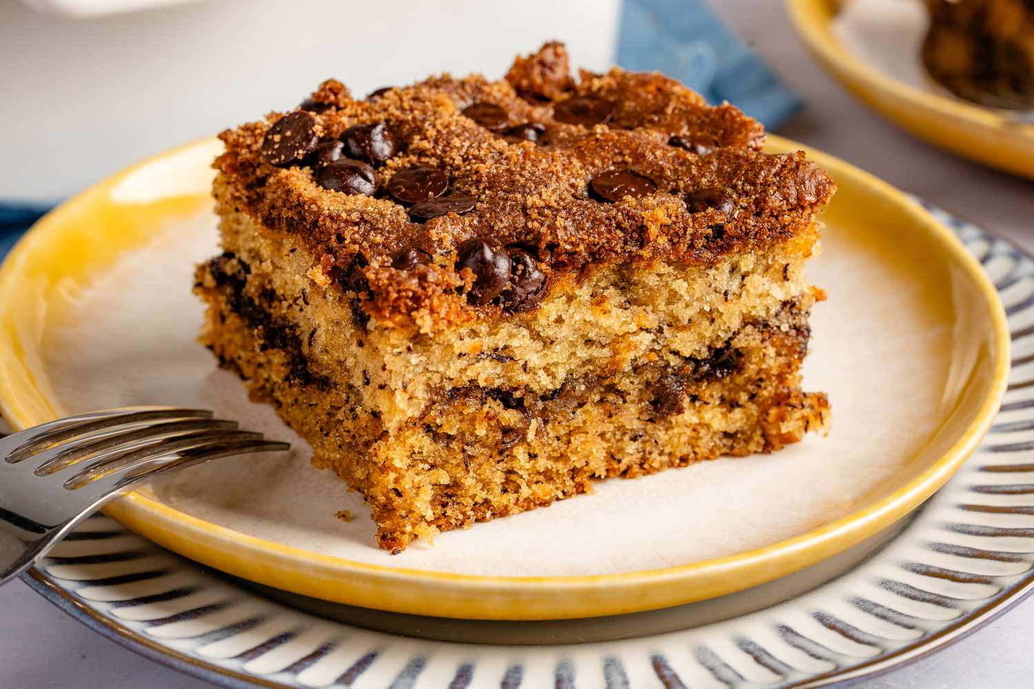 a slice of Ponderosa Cake on a dessert plate with a fork