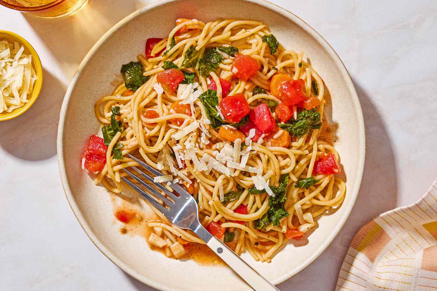One-Pot Spaghetti with Kale on a plate with a fork