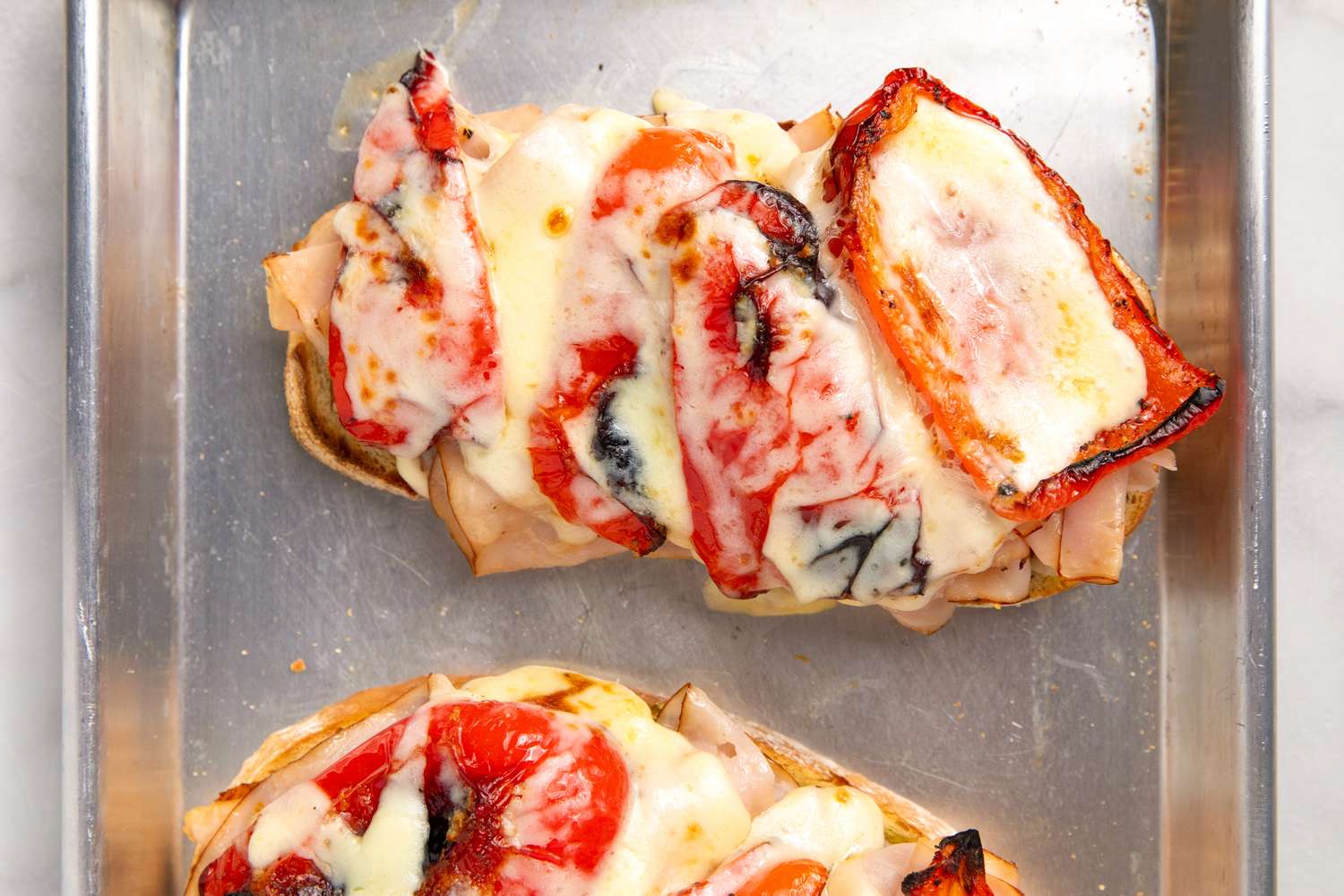 Open-Face Turkey Pesto Sandwich on a small sheet pan