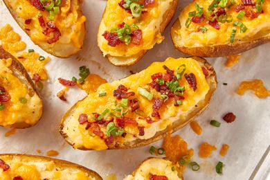 Twice baked potatoes on a piece of parchment paper
