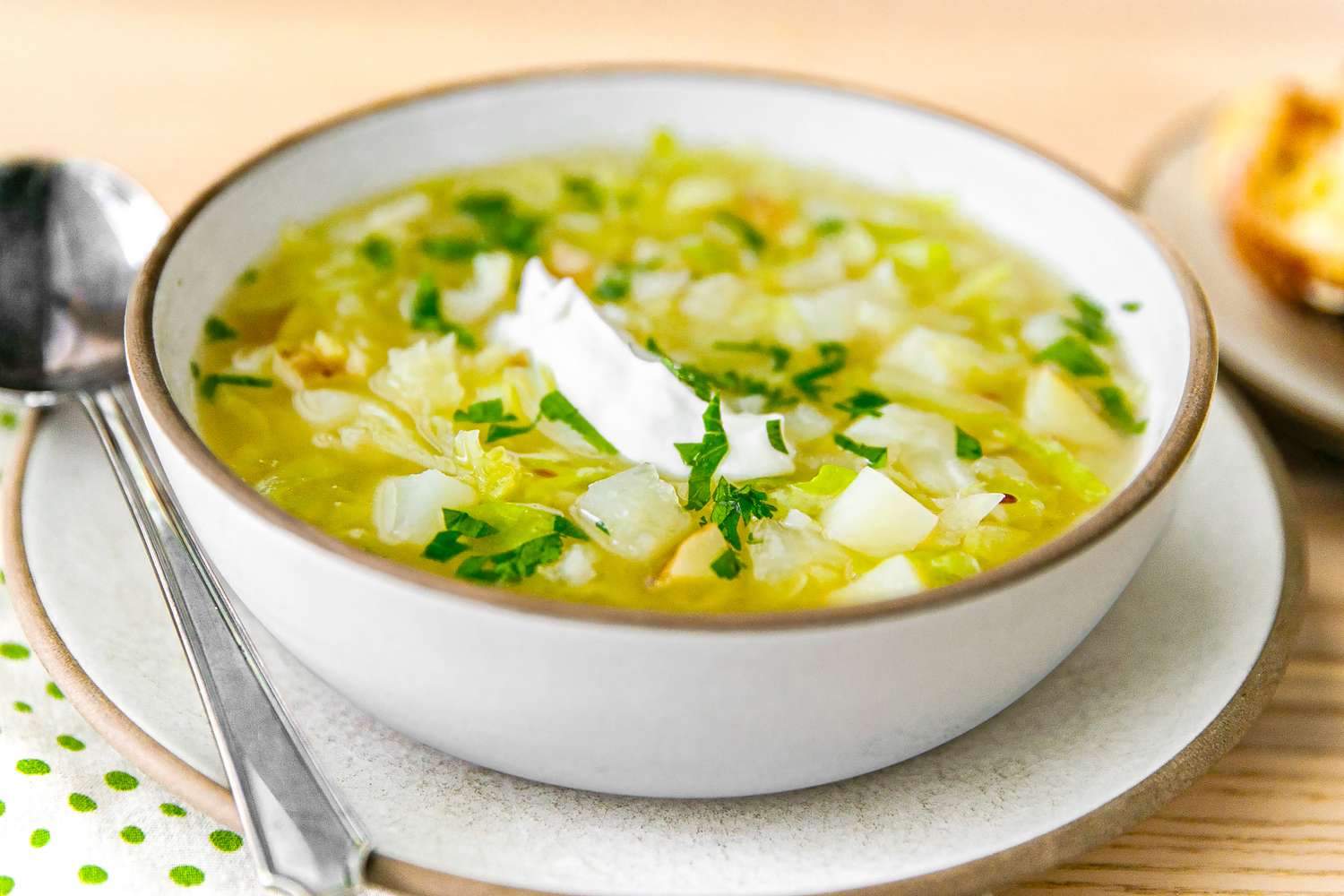 Swedish Cabbage Soup in a bowl with a spoon