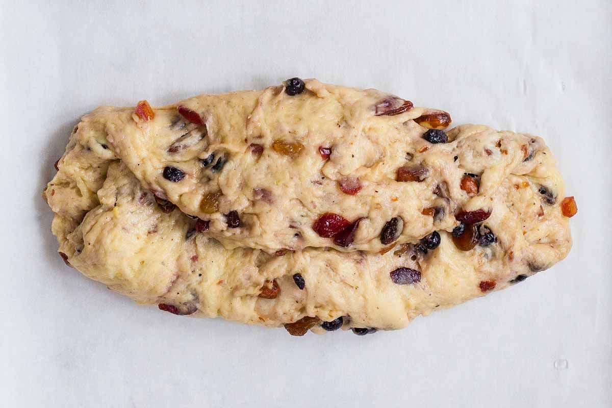 Stollen Christmas Bread dough filled with rum-soaked dried fruit folded into thirds.
