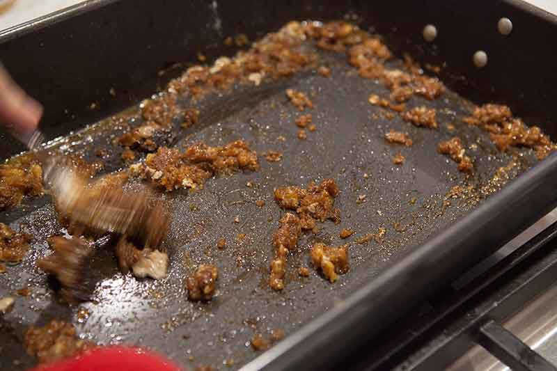 A baking dish with the flour and scrapings mixture