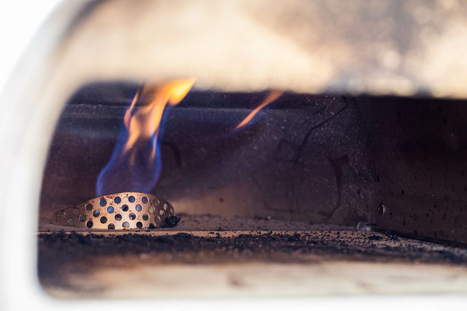 What is the Roccbox? This photo shows the inside of the pizza oven with the flame visible.