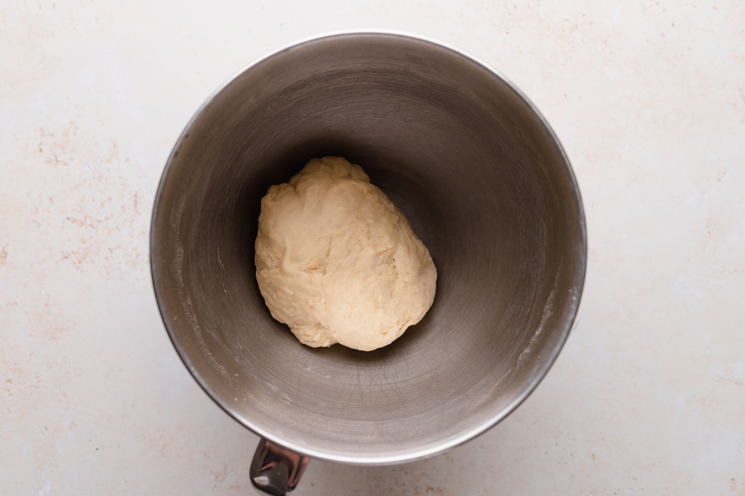 Kneaded dough in the bowl of a stand mixer to make braided chocolate babka