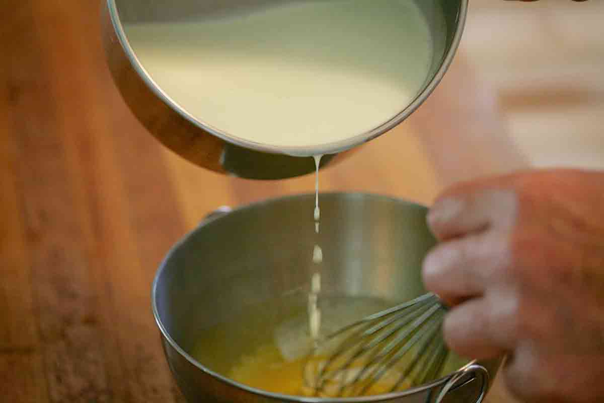 Warm Egg Yolks Being Poured into Sauce Pan