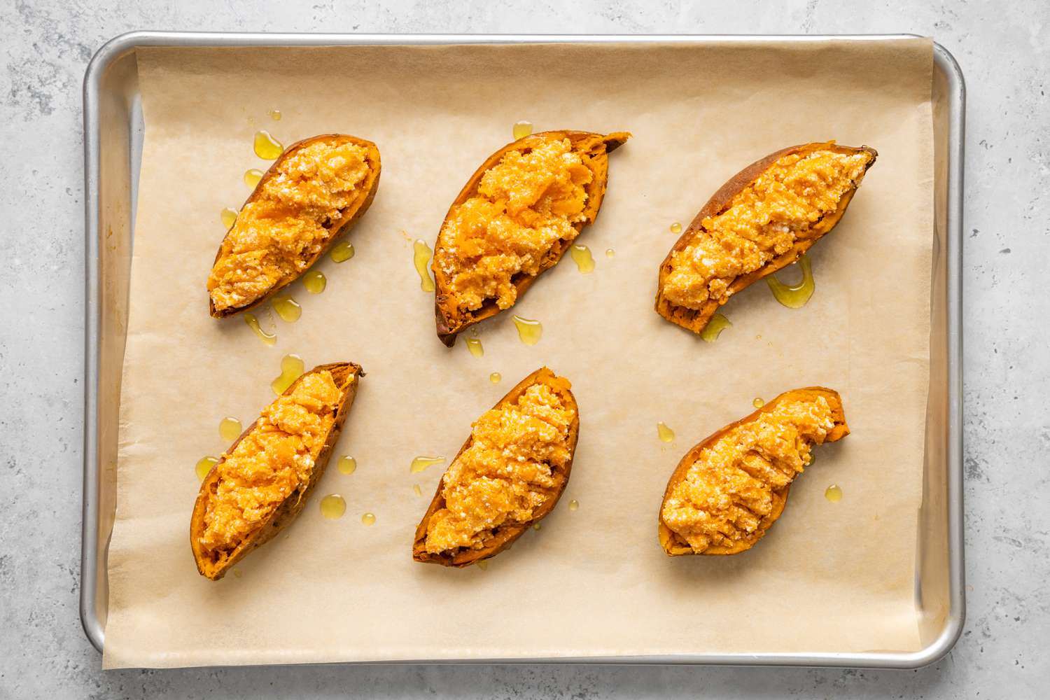 Stuffed sweet potatoes on baking sheet