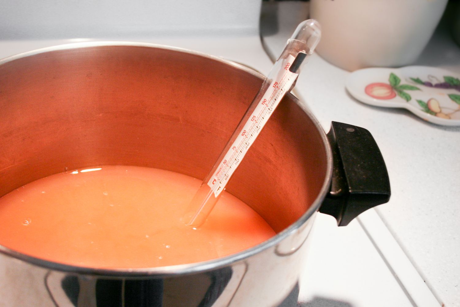 A pot of quince juice and sugar for making quince jelly