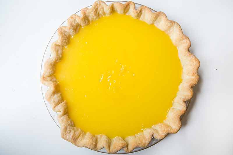 Pie shell filled with lemon curd filling for lemon meringue pie