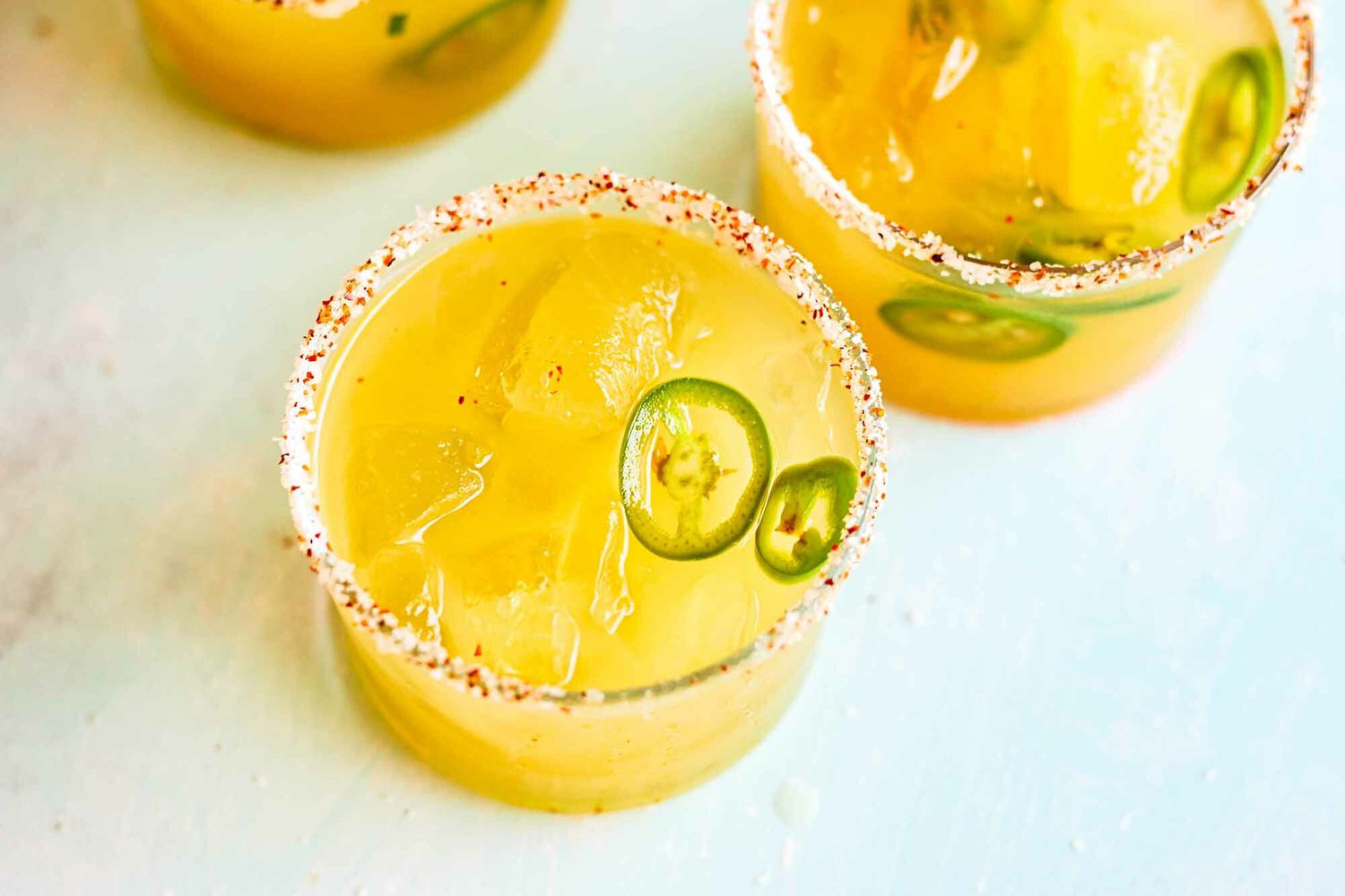 Pineapple Jalapeño Pitcher Margaritas in small glasses