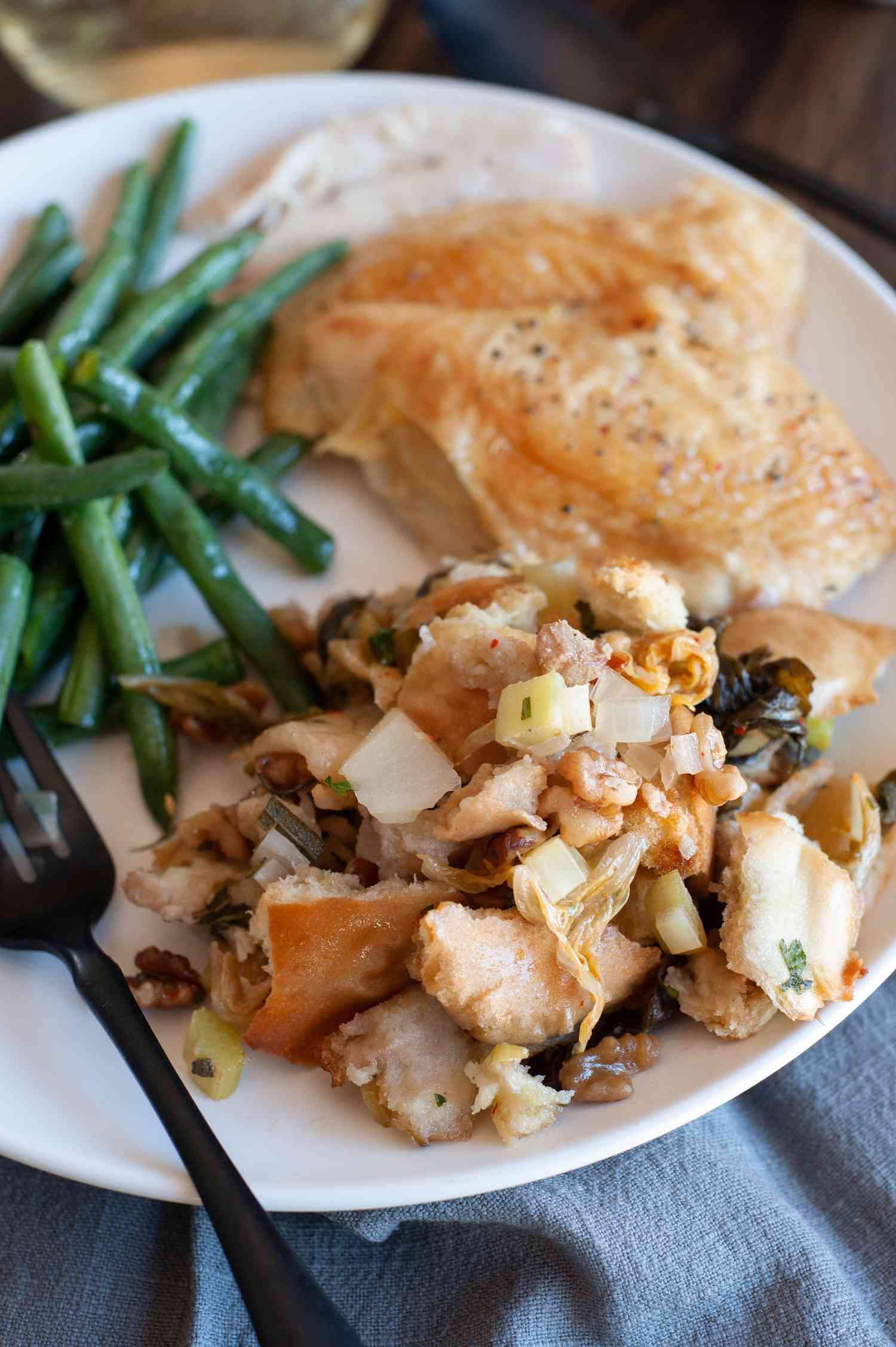 A plate with kimchi stuffing and green beans.