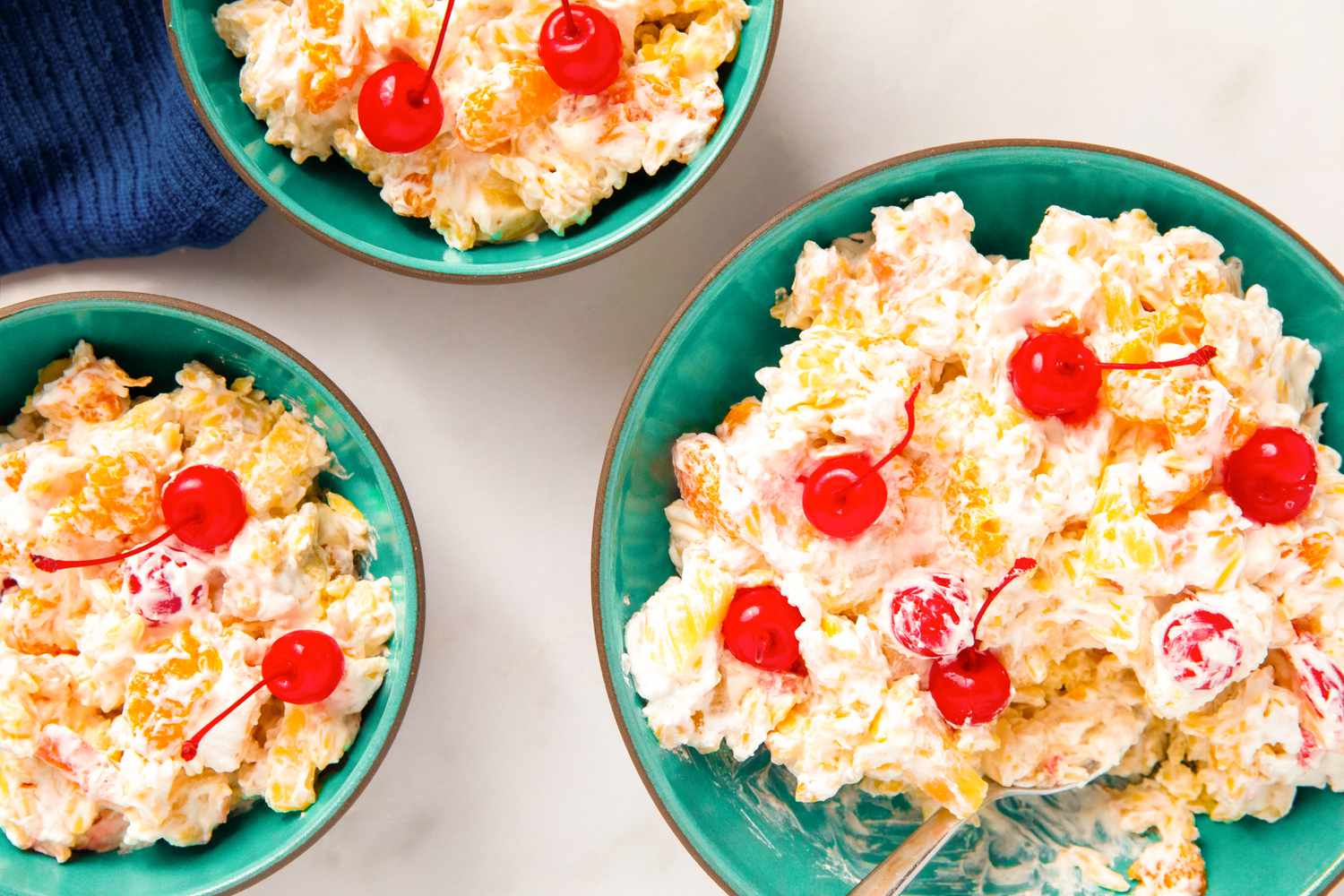 Bowls of Rosa Marina salad garnished with cherries