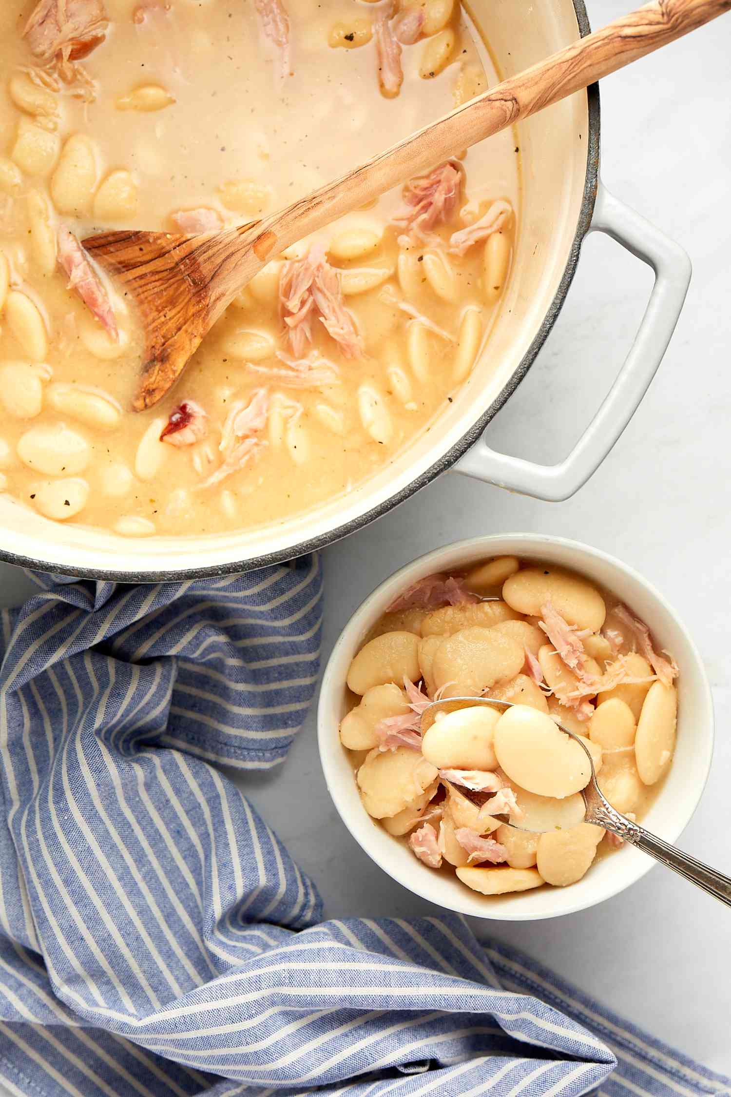 Creamy Southern Lima Beans in a Bowl Next to a Pot with More
