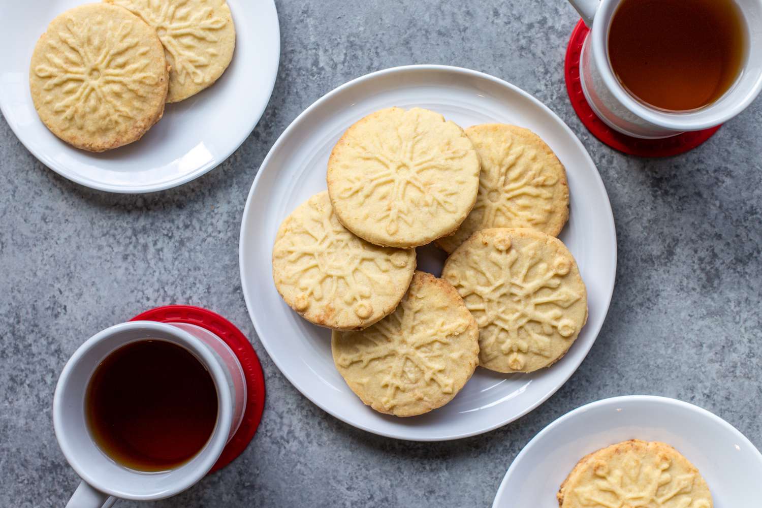 Overhead view of a plate with marzipan stamped cookies.
