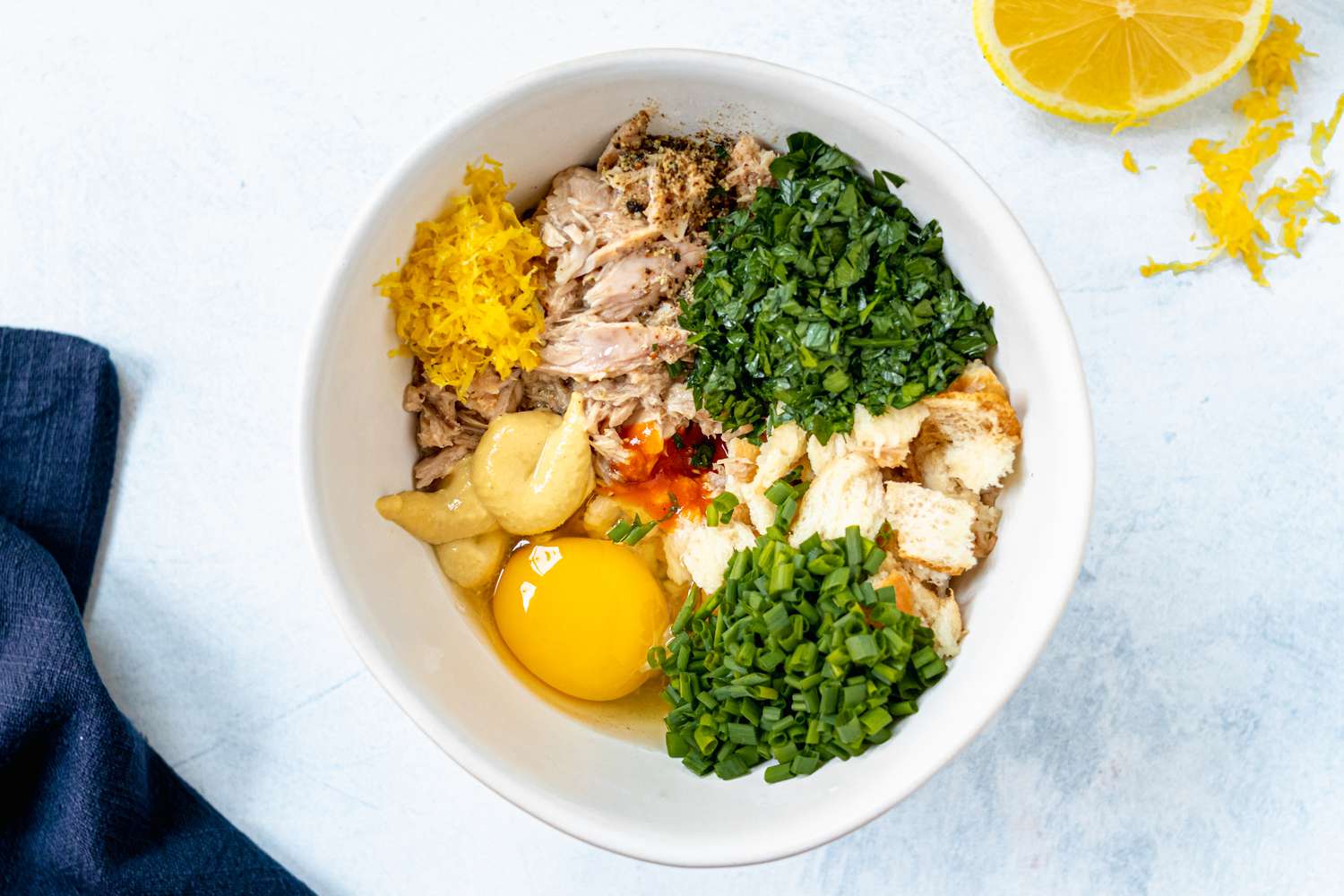 Ingredients in a bowl to make a tuna cakes recipe.