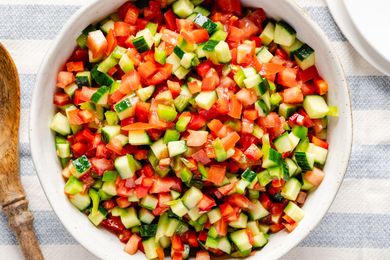 A bowl of pipirrana salad featuring diced cucumbers tomatoes and peppers