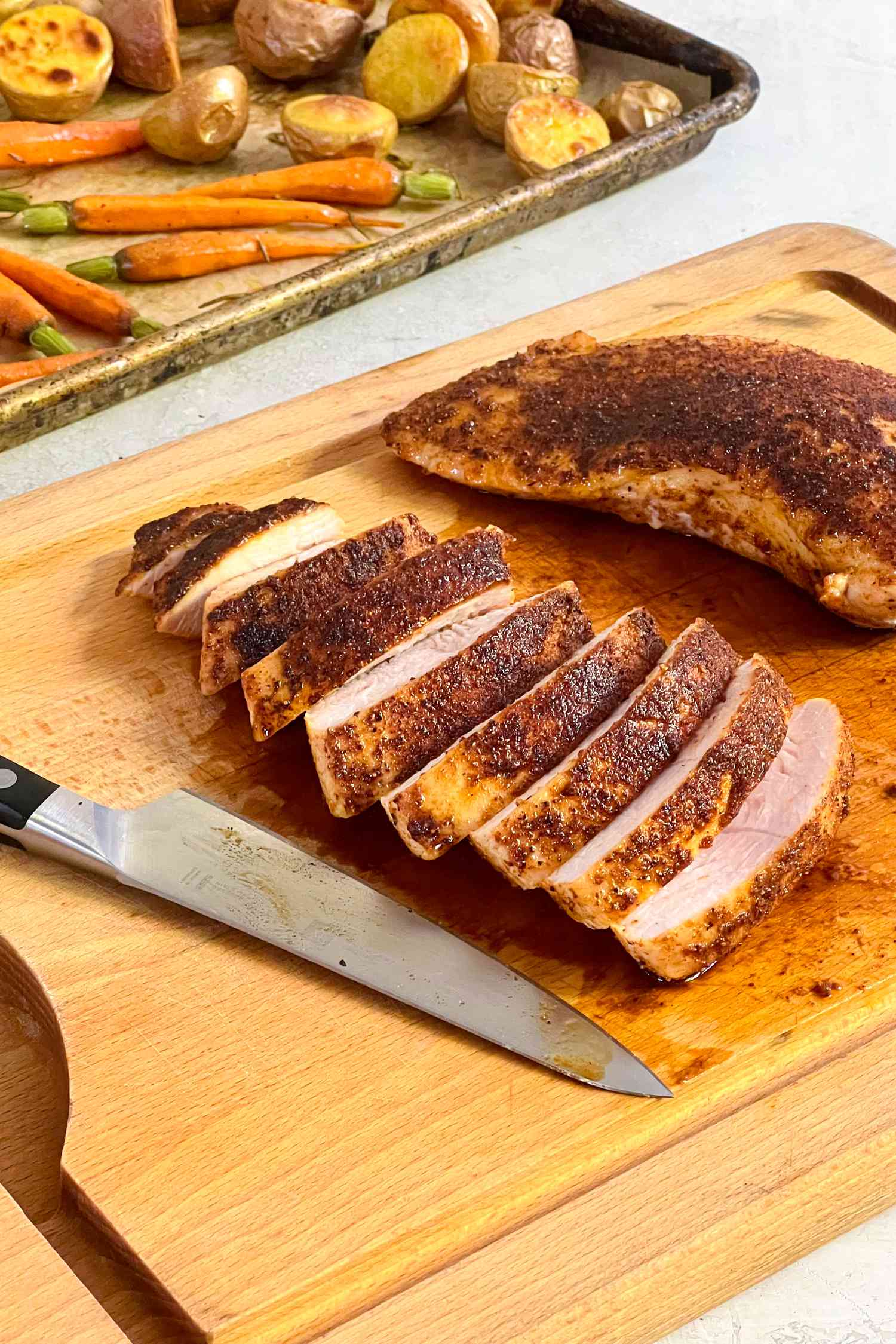 Turkey Tenderloin Sliced on a Cutting Board