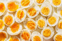 boiled egg halves topped with salt and pepper