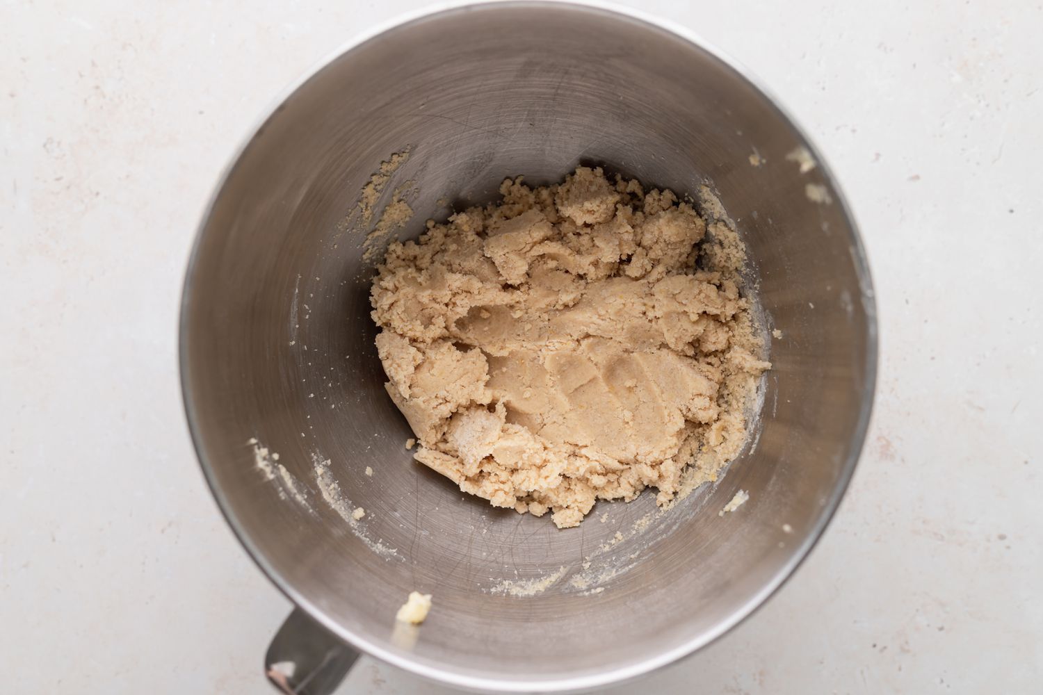 Dough to make classic linzer cookies in a mixer bowl.