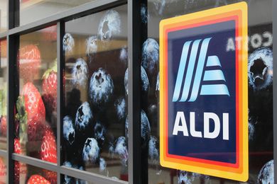 Aldi logo in a window of an Aldi store
