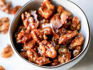 Candied walnuts in a white bowl