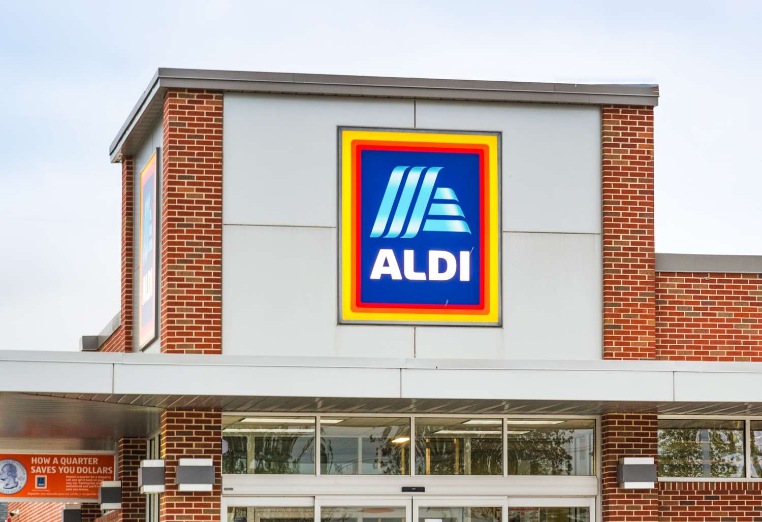 Storefront of Aldi with the logo prominently displayed on the building