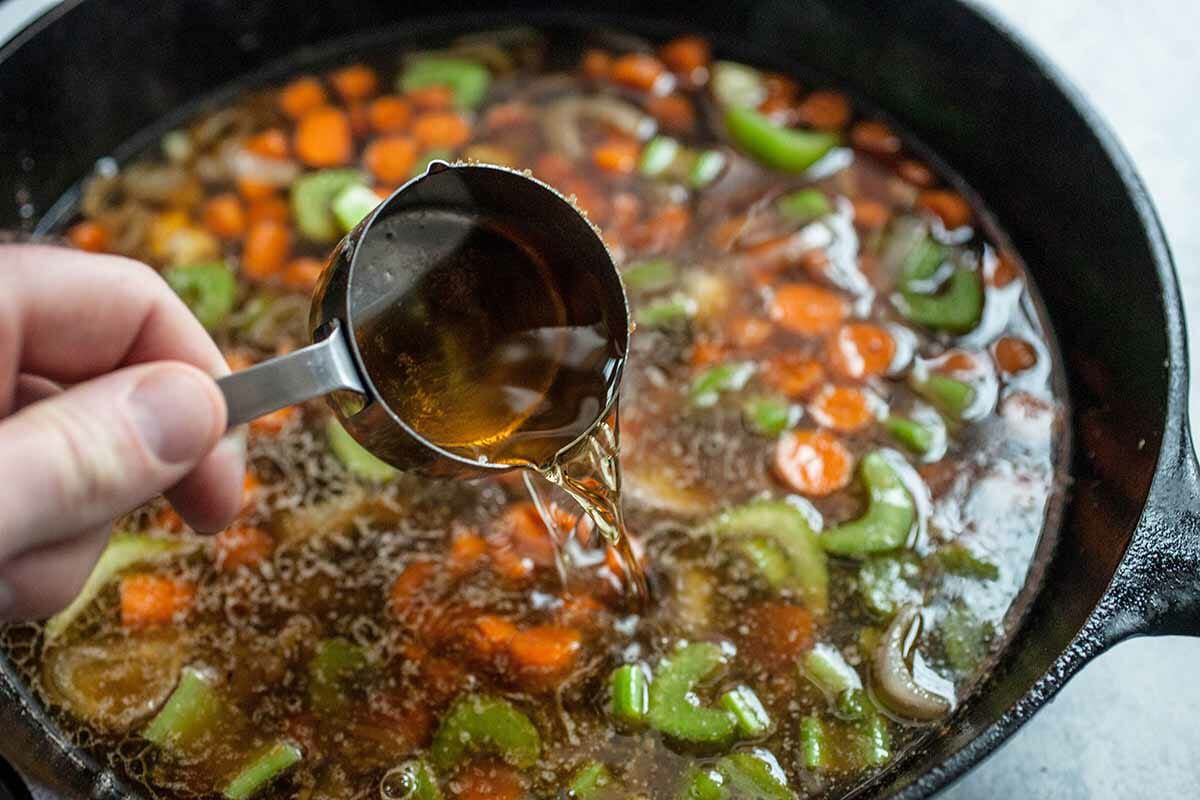 add the broth and veggies to the skillet with the browned short ribs
