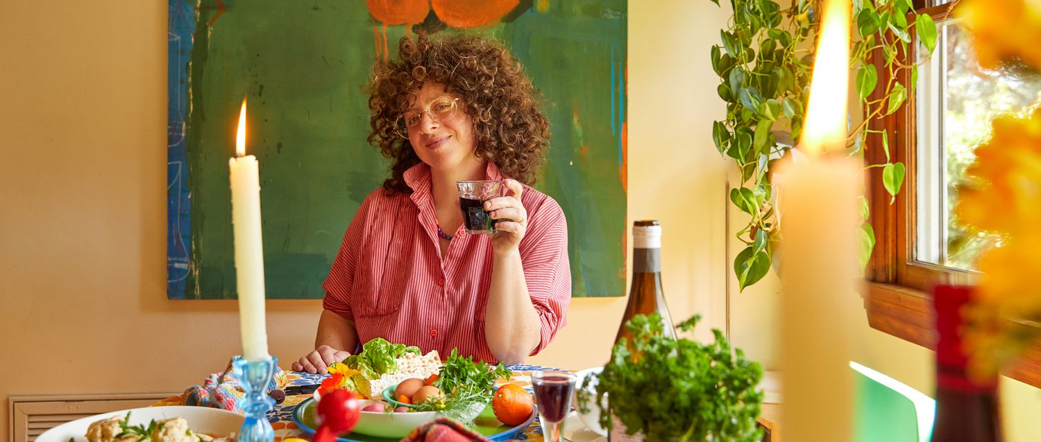 Zoe Toasting at the table with food and candles set