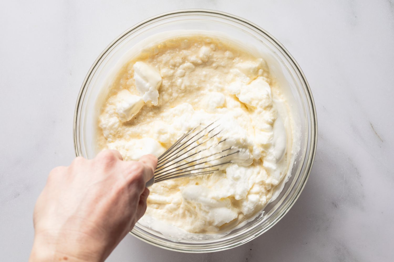 egg whites carefully whisked into the egg yoke batter for magic cake (gÃ¢teau magique) recipe