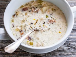 Bowl of Classic New England Chowder with a Spoon