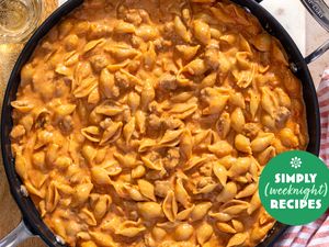 A pan of creamy pasta shells with a Simply Recipes logo overlay