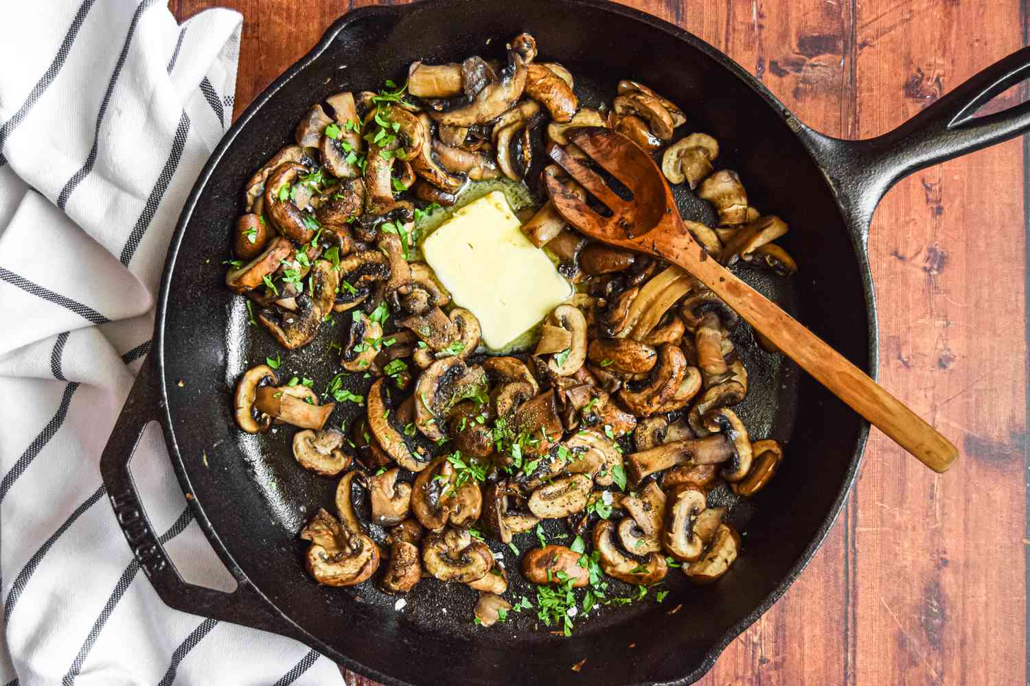 Butter and Herbs Added to Skillet of Mushrooms for A Better Way to Cook Mushrooms