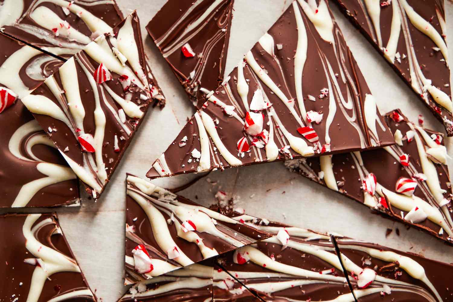 Pieces of chocolate layered with white chocolate and crushed peppermint candy