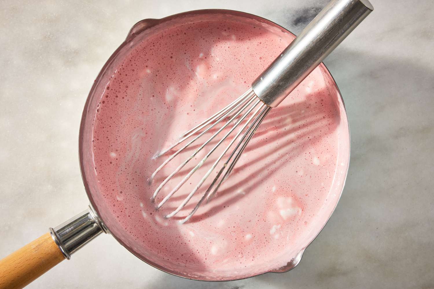 marshmallow fluff, condensed milk, and salt whisked into the cooked strawberries in the pot for strawberry marlow recipe