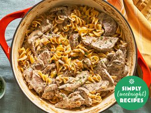 Beef stroganoff with noodles in a red pot