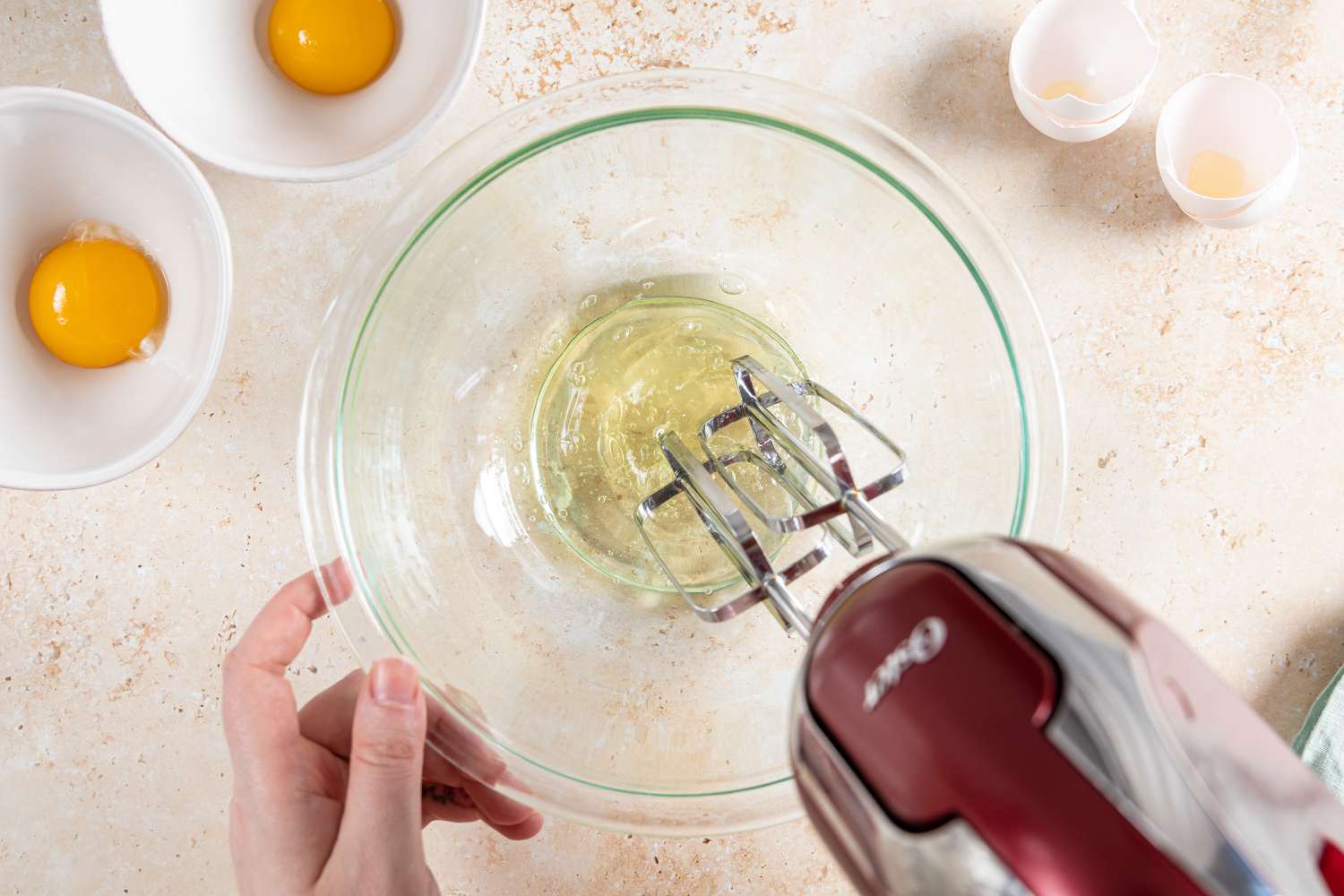 Beating egg whites with a hand mixer to make Cloud Eggs
