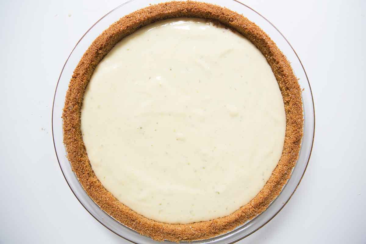 Pour the key lime pie filling into the pre-baked pie crust