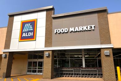 Aldi storefront with a large sign displaying Food Market above the entrance