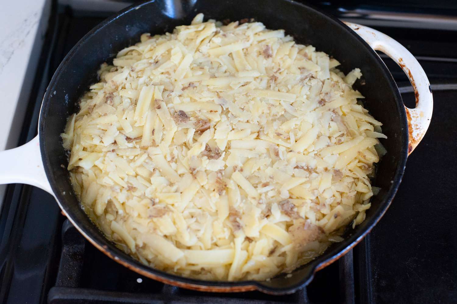 Rosti in a Skillet on the Stove