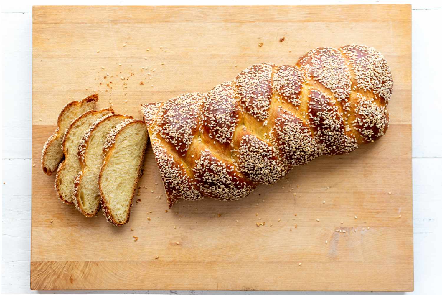 sliced challah on cutting board