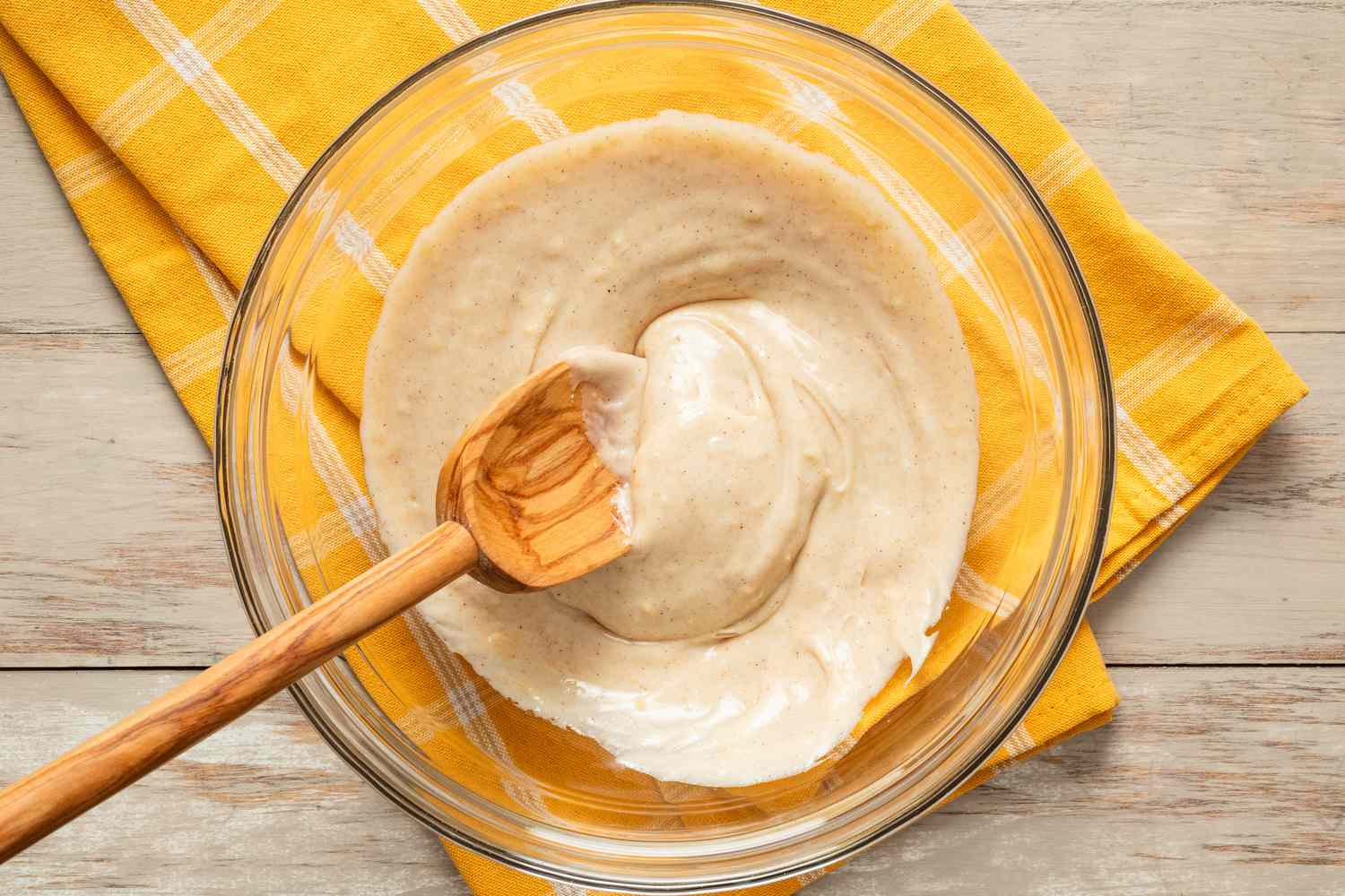 Filling ingredients mixed together in a bowl for mardi gras king cake