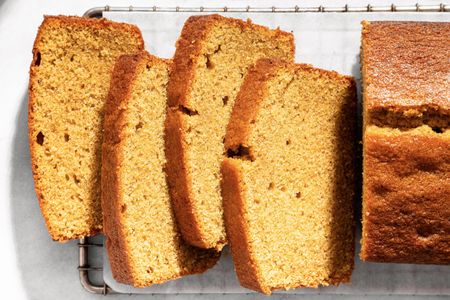 Sliced brown sugar pound cake on a cooling rack displaying its texture and layers