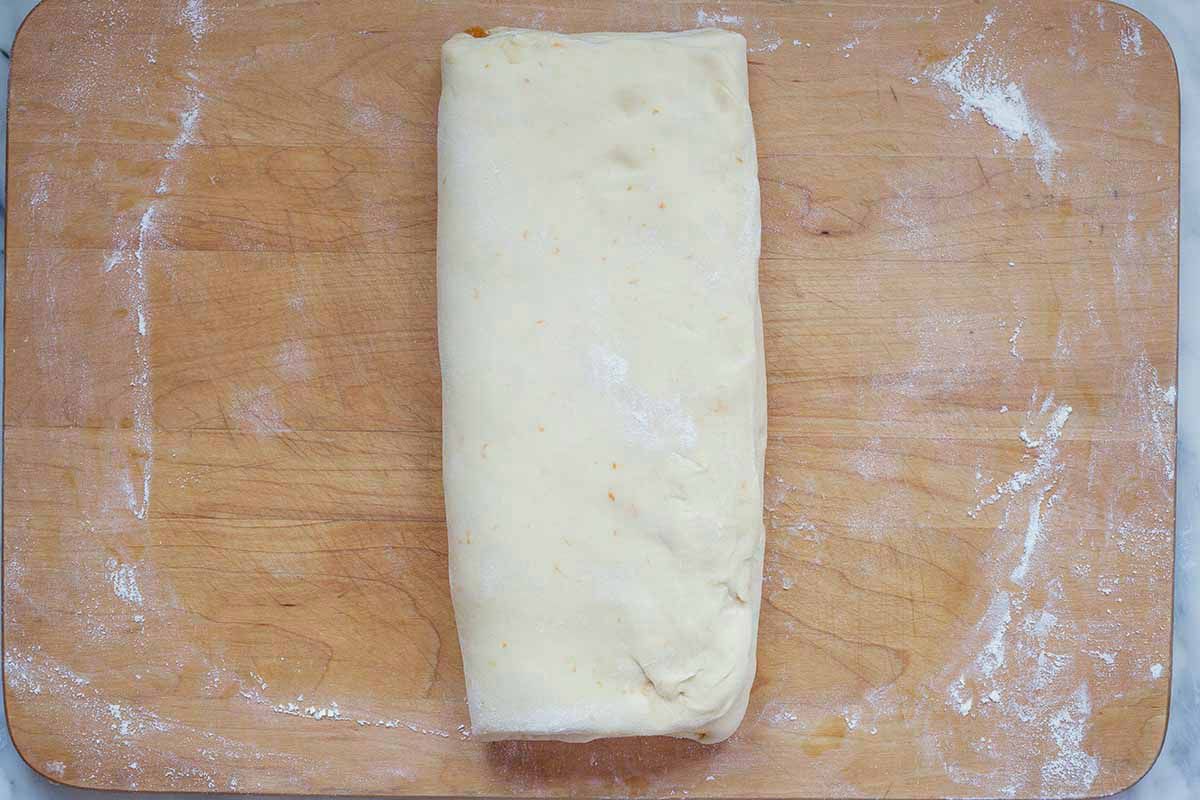 Rectangle of panettone dough on a cutting board